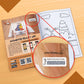  The image depicts a brown background with an open book placed on it, with an activation code zoomed in from the book.