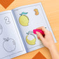 The image depicts a hand using an eraser to erase crayon marks in a colouring book.