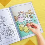 The image depicts a hand coloring a book with crayons.