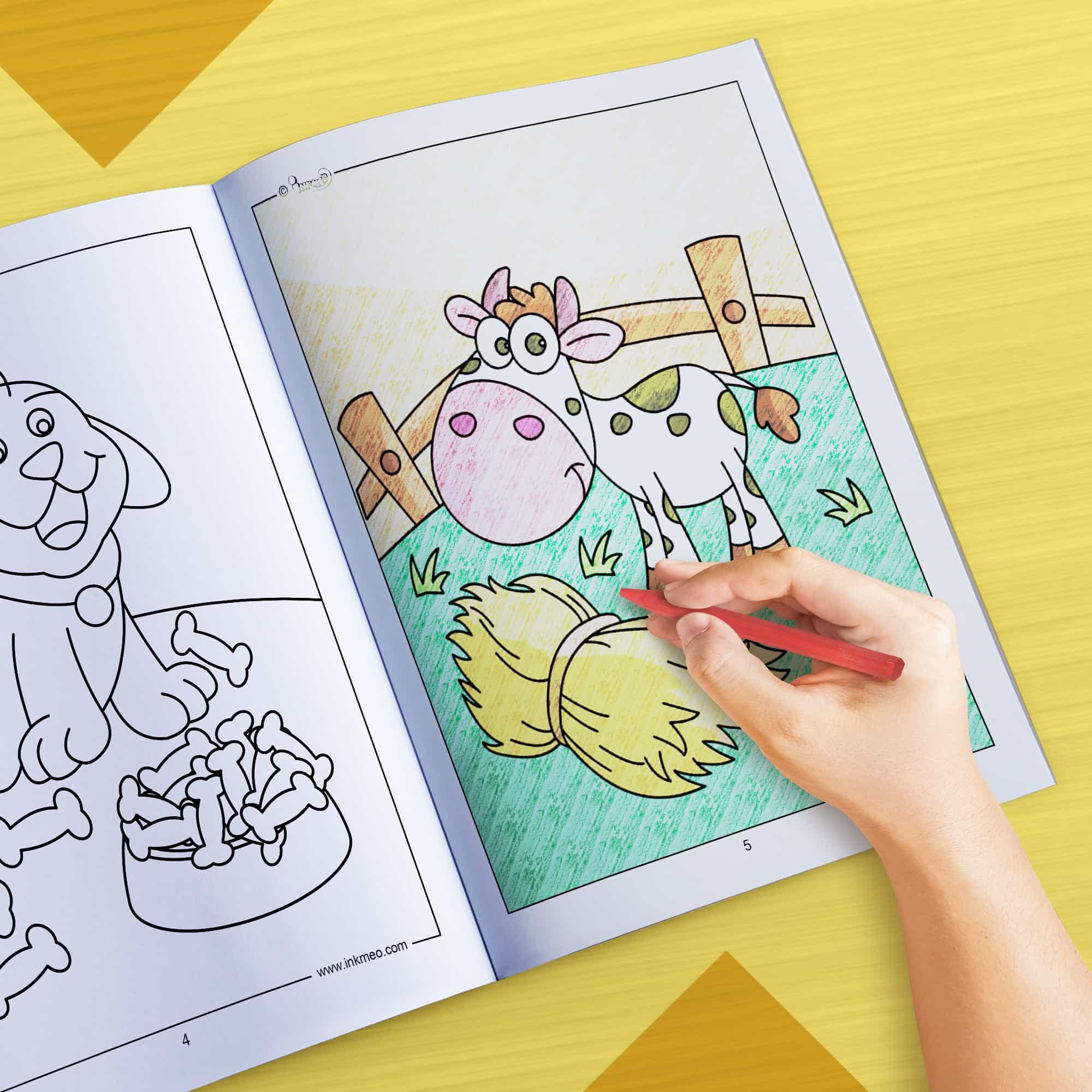 The image depicts a hand coloring a book with crayons.