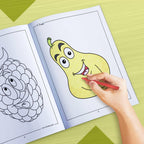 The image depicts a hand coloring a book with crayons.